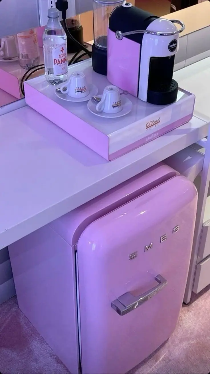  A Stylish Small Pink Refrigerator and Coffee Maker